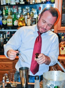 Jason Withrow, bar manager of REDD, adds a special tincture to a custom cocktail. (photo: David Bennion, used with permission)