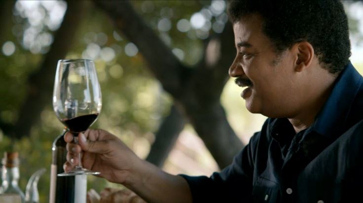 Neil DeGrasse Tyson enjoys a glass of wine on a recent episode of "Cosmos"